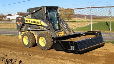 john deere skid steer with a power rake|best skid steer power rake.